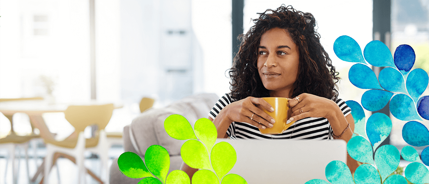 woman holding a cup of coffee in a cafe